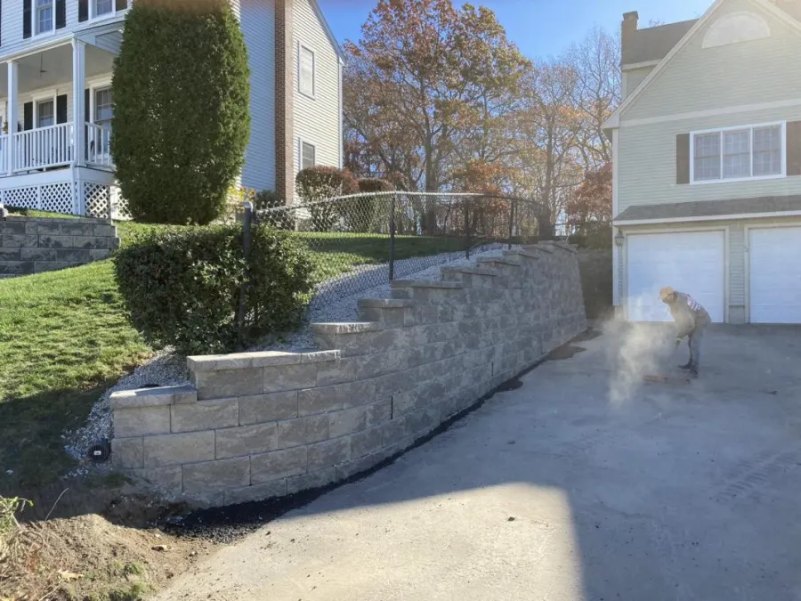Segmental block retaining wall beside a driveway